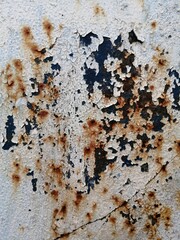 industrial background and texture of rusty iron surface with weathered white paint
