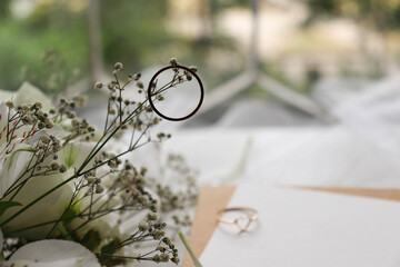 wedding card design. wedding rings on the table with flowers. marriage proposal