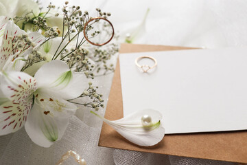 wedding card design. wedding rings on the table with flowers. marriage proposal