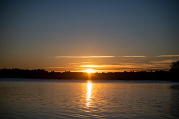 vintage churches on the island at sunrise on the background of the lake