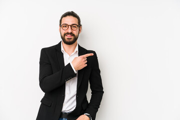 Young caucasian business man isolated on a white background smiling and pointing aside, showing something at blank space.