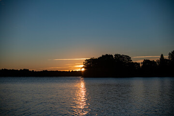 Naklejka premium vintage churches on the island at sunrise on the background of the lake