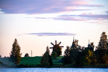 vintage churches on the island at sunrise on the background of the lake