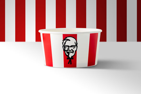 BANGKOK, THAILAND - August 24, 2020:  Illustrative editorial image of KFC soft drink paper cup on red striped background. KFC is an American fast food restaurant chain known as Kentucky Fried Chicken.