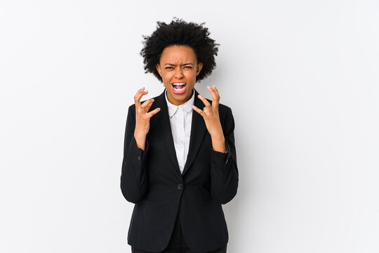 Middle Aged African American Business  Woman Against A White Background Isolated Upset Screaming With Tense Hands.