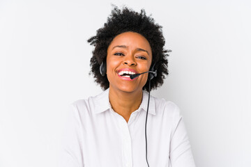 Young african american telemarketer woman isolated laughing and having fun.