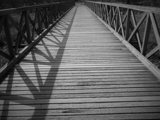 Black and white old wooden bridge dateil with shadow in Budapest suburb, Hungary
