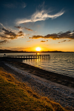 Woman on a pier at sunset © Ingmar