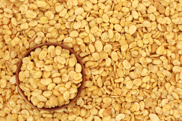 Fava beans for a healthy vegan & vegetarian diet snack food in a wooden bowl forming a background....