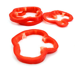 red pepper slices on white background