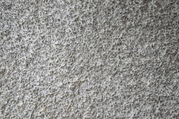 decorative coating with fine stone abrasive, light background