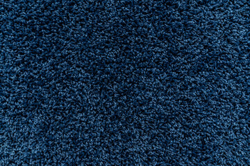 The texture of a blue carpet. Fleecy surface. Background