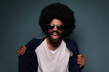 Beautiful afro man in front of a colored background