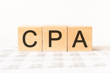 Certified public accountant, CPA. Wooden small cubes with letters isolated on white background with copy space available