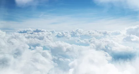 Poster Himmel mit schönen Wolken aus dem Flugzeugfenster © Lukas Gojda