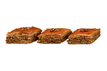 Baklava is a perfectly cut image on a white background of an Oriental dessert made of puff pastry with honey and nuts.
