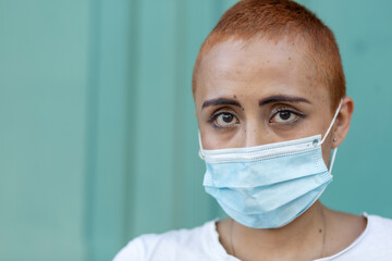 Woman with a face Mask on a cyan background