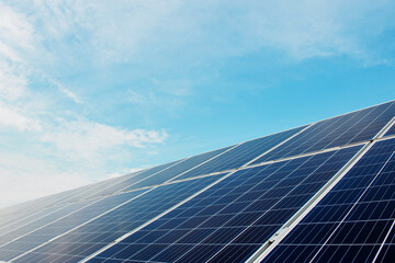 Photovoltaic power plant. Solar photovoltaic panels on blue sky background