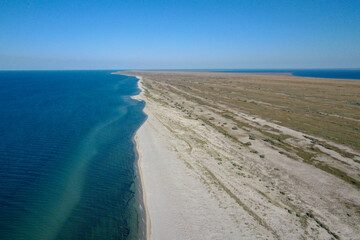 Island in the sea view from the top. Azure water and white sand