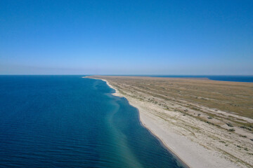 Island in the sea view from the top. Azure water and white sand