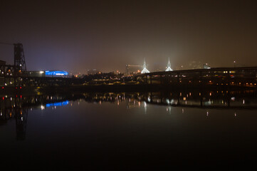 Highway Bridge and Buildings Reflected in Willamette River at Night, Portland, Oregon, USA