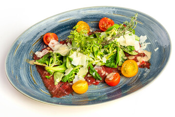 Veal carpaccio with arugula, parmesan and cherry tomatoes