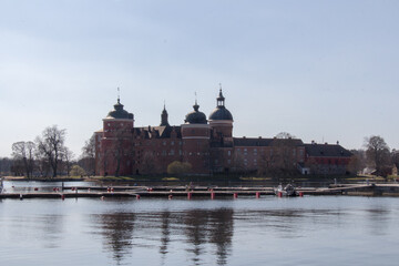 Mariefred pier and Gripsholm Castle in a sunny day, Mariefred, Sweden.
