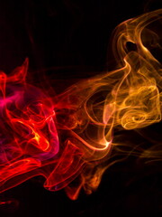 Colored smoke on black background