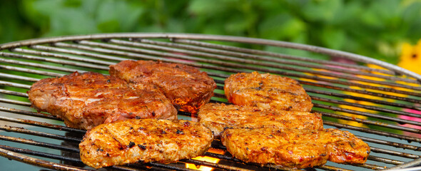 Grilling pork on the grill