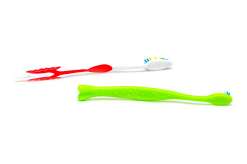 White background on it toothbrushes of different colors are arranged in a chaotic manner oral hygiene isolate, brushing teeth