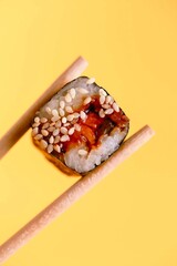 fresh sushi on sticks on a yellow background