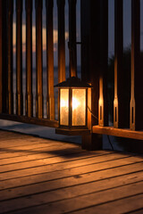old lamp on the wooden balcony