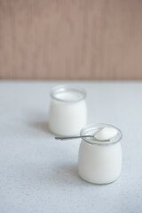 two glass jars with classic thermostat yoghurt.