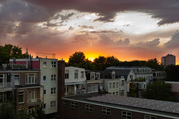 Beautiful sunset sky over Amsterdam rooftops.