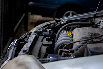 Old dirty car engine in need of a wash