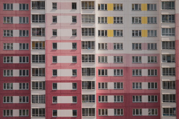 texture concrete wall background, many windows, skyscraper tall house, stay at home pink wall with windows of a large house