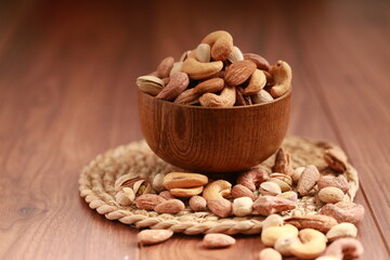 Nuts mix in a wooden plate