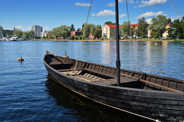 An old wooden sail boat moored along one of the many rivers in Finland.