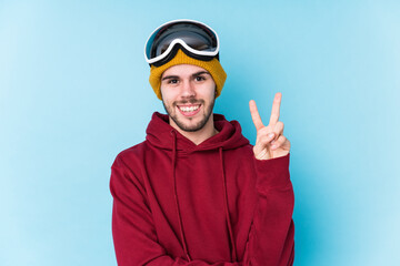 Young caucasian man wearing a ski clothes isolated showing number two with fingers.