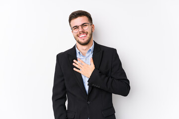 Young caucasian business man posing in a white background isolated Young caucasian business man laughs out loudly keeping hand on chest.