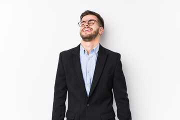 Young caucasian business man posing in a white background isolated Young caucasian business man relaxed and happy laughing, neck stretched showing teeth.