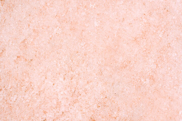 Salt crystals at the bottom of a pink salt lake. The texture of the bottom of a salt lake in Crimea. Focusing on the center of the frame.