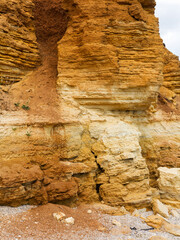 Desert landscape with multi-colored yellow, green and blue clay deposits of minerals in geological formations