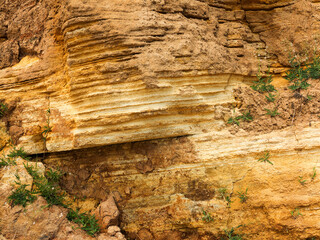 Desert landscape with multi-colored yellow, green and blue clay deposits of minerals in geological formations