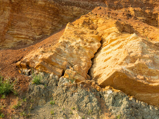 Desert landscape with multi-colored yellow, green and blue clay deposits of minerals in geological...