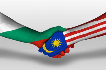 Handshake between malaysia and bulgaria flags painted on hands, illustration with clipping path.