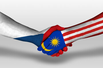 Handshake between malaysia and czech republic flags painted on hands, illustration with clipping...