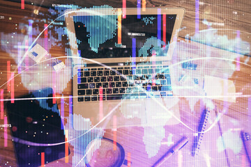 Business theme hologram drawings over computer on the desktop background. Top view. Multi exposure. Concept of international connections.