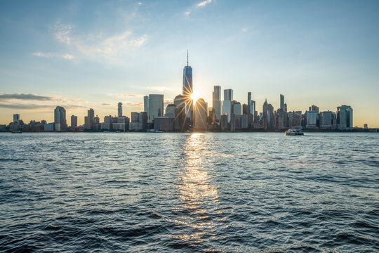 Lower Manhattan skyline with One World Trade Center at sunrise