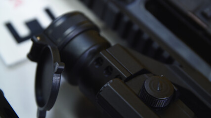 Naklejka na ściany i meble close up of ar15 assault military rifle with a sight. High quality photo